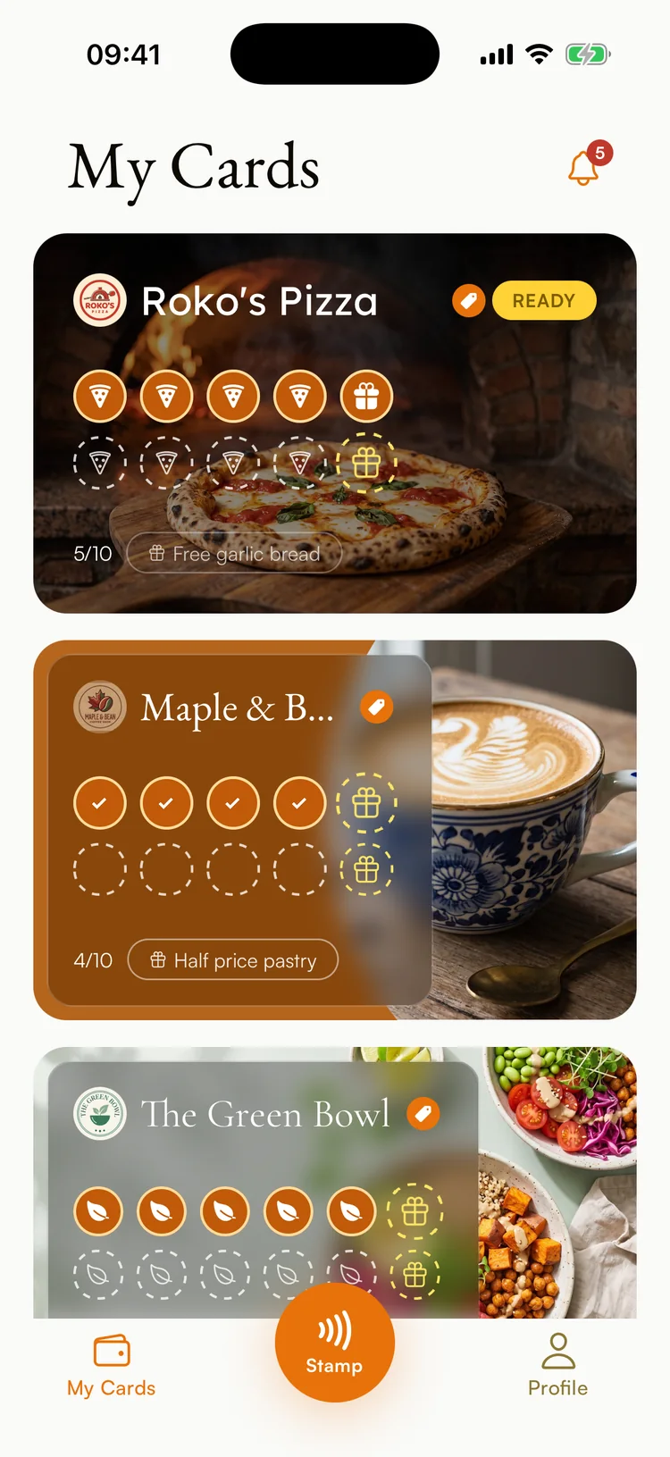 A customer’s Ambr app holding four shops’ loyalty cards, each with its own photo, font and stamps